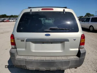 2006 Ford Escape XLT with VIN 1FMCU03116KA69312, listed as a Copart auction lot 70773514 with 164,079 mi miles and Salvage Title. Bid and sale history available at carsss.com. Image 6.