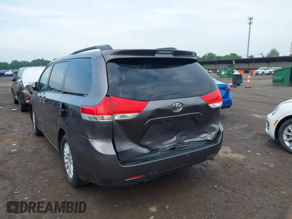 2014 Toyota Sienna XLE with VIN 5TDYK3DC0ES496716, listed as a IAAI auction lot 42494549 with 158,645 mi miles and . Bid and sale history available at DreamBid. Image 6.