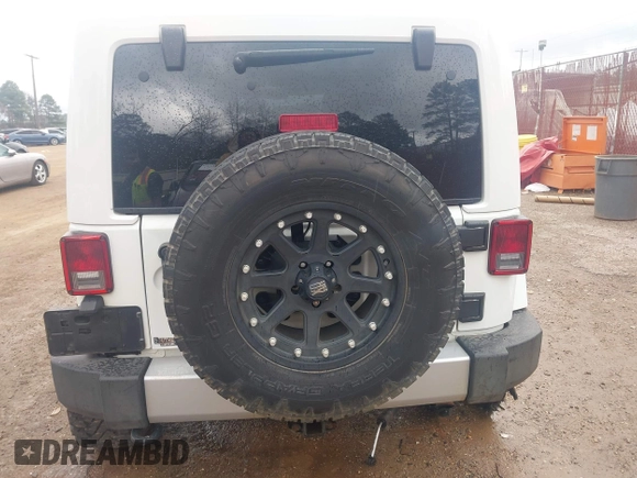 2014 Jeep Wrangler Unlimited Sahara z VIN 1C4BJWEG6EL245986, wystawiony jako IAAI lot #41498492 z przebiegiem 125 882 mil mil oraz . Historia ofert i sprzedaży dostępna na DreamBid. Obrazek 17.