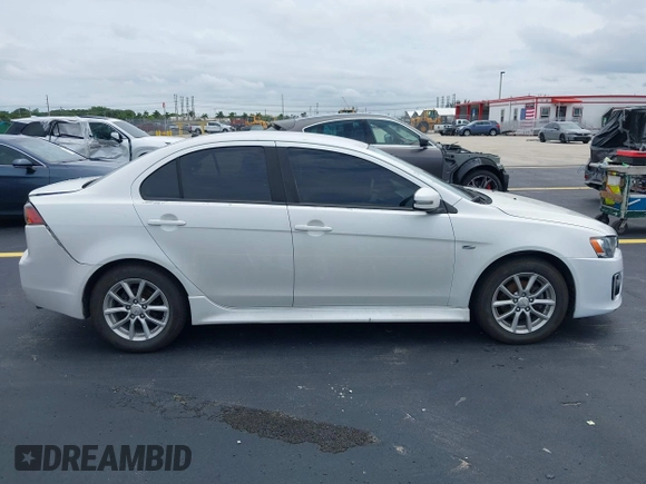 2016 Mitsubishi Lancer ES z VIN JA32U2FU7GU000923, wystawiony jako IAAI lot #42238951 z przebiegiem 134 955 mil mil oraz . Historia ofert i sprzedaży dostępna na DreamBid. Obrazek 13.