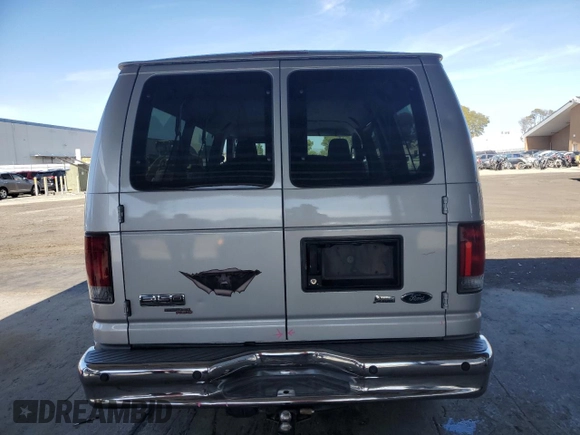2010 Ford Econoline Passenger XL with VIN 1FMNE1BW3ADA25124, listed as a Copart auction lot 56899235 with 244,010 mi miles and Salvage title. Bid and sale history available at DreamBid. Image 6.
