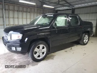 2010 Honda Ridgeline RTL with VIN 5FPYK1F50AB012259, listed as a Copart auction lot 60214895 with 169,475 mi miles and Salvage title. Bid and sale history available at DreamBid. Image 1.