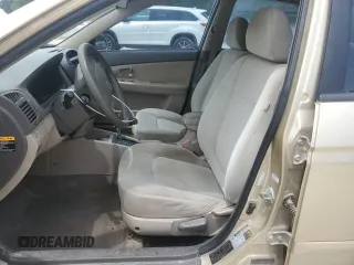 2009 Kia Spectra EX with VIN KNAFE221X95648679, listed as a Copart auction lot 55967485 with 182,740 mi miles and Non Repairable. Bid and sale history available at DreamBid. Image 7.