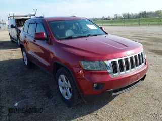 2013 Jeep Grand Cherokee Laredo with VIN 1C4RJEAG9DC538259, listed as a IAAI auction lot 41832676 with 143,000 mi miles. Bid and sale history available at carsss.com. Image 1.