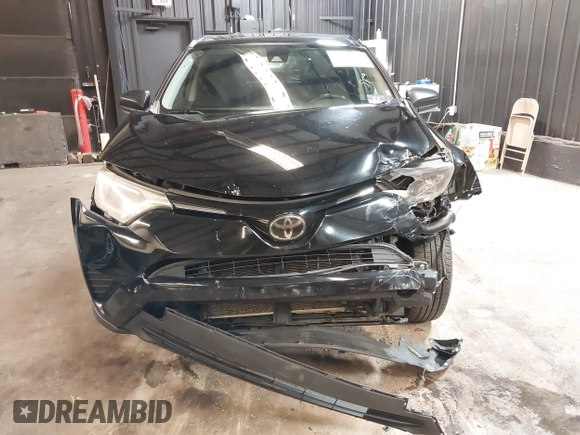 2018 Toyota RAV4 LE with VIN 2T3BFREV7JW768376, listed as a IAAI auction lot 41864571 with 292,147 mi miles. Bid and sale history available at carsss.com. Image 6.