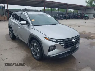 2022 Hyundai Tucson SEL z VIN 5NMJFCAE1NH153444, wystawiony jako IAAI lot #42267845 z przebiegiem 28 927 mil mil oraz . Historia ofert i sprzedaży dostępna na DreamBid. Obrazek 1.