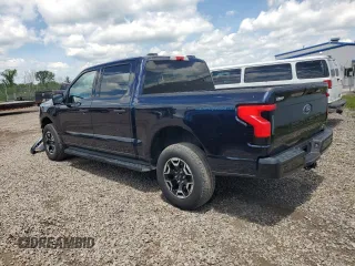 2022 Ford F-150 Lightning Pro z VIN 1FTVW1EL6NWG04931, wystawiony jako Copart lot #59096435 z przebiegiem 26 616 mil mil oraz Szkody całkowita. Historia ofert i sprzedaży dostępna na DreamBid. Obrazek 2.