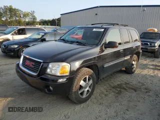 2004 GMC Envoy SLT with VIN 1GKDT13S942407244, listed as a Copart auction lot 70995064 with 162,676 mi miles and Salvage Title. Bid and sale history available at carsss.com. Image 1.
