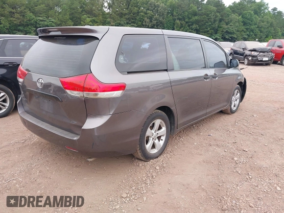 2014 Toyota Sienna L with VIN 5TDZK3DC8ES470837, listed as a IAAI auction lot 42426844 with 302,661 mi miles and . Bid and sale history available at DreamBid. Image 4.
