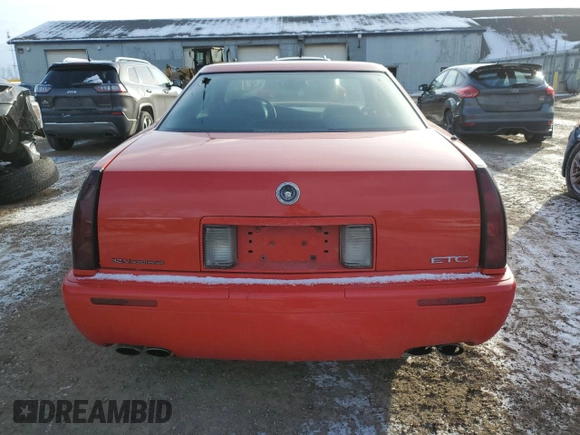2002 Cadillac Eldorado z VIN 1G6EC12972B106132, wystawiony jako Copart lot #86799624 z przebiegiem 75 334 mil mil oraz Szkoda całkowita • Salvage title. Historia ofert i sprzedaży dostępna na DreamBid. Obrazek 6.
