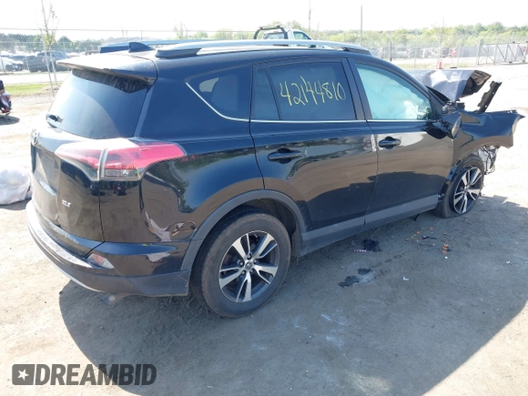 2018 Toyota RAV4 XLE with VIN 2T3WFREVXJW484872, listed as a IAAI auction lot 42144810 with Not provided miles and . Bid and sale history available at DreamBid. Image 4.