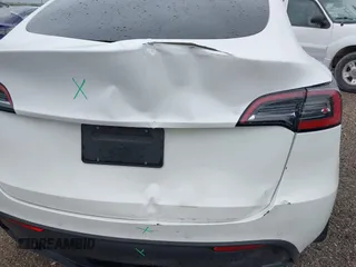2022 Tesla Model Y Long Range z VIN 7SAYGDEE3NF426481, wystawiony jako IAAI lot #42076729 z przebiegiem 21 648 mil mil oraz . Historia ofert i sprzedaży dostępna na DreamBid. Obrazek 23.