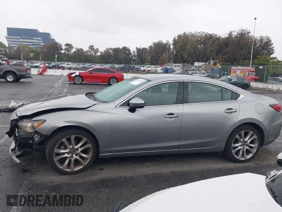 2014 Mazda 6 i Touring with VIN JM1GJ1V60E1141831, listed as a IAAI auction lot 42131200 with 86,597 mi miles and . Bid and sale history available at DreamBid. Image 14.