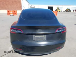 2020 Tesla Model 3 Standard Range Plus with VIN 5YJ3E1EA0LF597761, listed as a IAAI auction lot 41773918 with 89,957 mi miles. Bid and sale history available at carsss.com. Image 15.