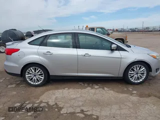 2017 Ford Focus Titanium with VIN 1FADP3J24HL229702, listed as a IAAI auction lot 42057013 with 120,250 mi miles and . Bid and sale history available at DreamBid. Image 13.
