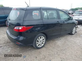 2015 Mazda 5 Sport with VIN JM1CW2BL2F0190990, listed as a IAAI auction lot 42532210 with 98,528 mi miles and . Bid and sale history available at DreamBid. Image 4.