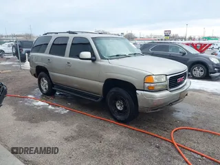 2002 GMC Yukon SLT with VIN 1GKEK13Z92R253868, listed as a IAAI auction lot 41335170 with 243,720 mi miles. Bid and sale history available at carsss.com. Image 1.