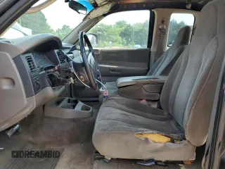 2001 Dodge Dakota z VIN 1B7GL22X81S204868, wystawiony jako Copart lot #57178895 z przebiegiem 298 667 mil mil oraz Szkoda całkowita • Salvage title. Historia ofert i sprzedaży dostępna na DreamBid. Obrazek 7.