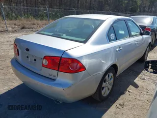 2007 Kia Optima EX with VIN KNAGE124975157963, listed as a IAAI auction lot 41673886 with 128,278 mi miles. Bid and sale history available at carsss.com. Image 4.
