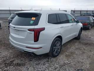 2021 Cadillac XT6 Premium Luxury with VIN 1GYKPFRS0MZ100879, listed as a IAAI auction lot 41083030 with 56,502 mi miles and . Bid and sale history available at DreamBid. Image 4.