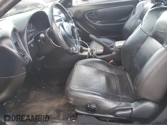 1998 Toyota Celica GT z VIN JT5FG02T2W0047564, wystawiony jako Copart lot #75727344 z przebiegiem 225 802 mil mil oraz Szkoda całkowita • Salvage title. Historia ofert i sprzedaży dostępna na DreamBid. Obrazek 7.