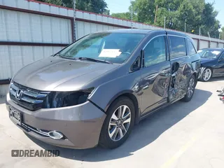 2014 Honda Odyssey Touring with VIN 5FNRL5H99EB075979, listed as a IAAI auction lot 42520154 with 99,314 mi miles and . Bid and sale history available at DreamBid. Image 2.