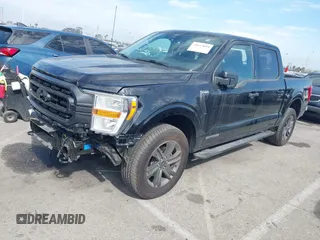 2023 Ford F-150 XL with VIN 1FTFW1ED8PFD08597, listed as a IAAI auction lot 41613094 with 7,266 mi miles and . Bid and sale history available at carsss.com. Image 2.