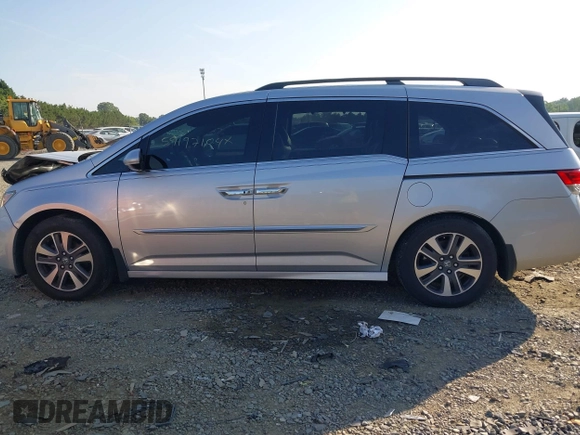 2014 Honda Odyssey Touring with VIN 5FNRL5H95EB108427, listed as a IAAI auction lot 39992643 with 100,658 mi miles and . Bid and sale history available at DreamBid. Image 14.