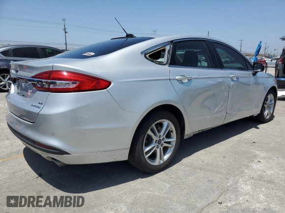 2018 Ford Fusion SE z VIN 3FA6P0LU8JR110693, wystawiony jako Copart lot #61931995 z przebiegiem 119 629 mil mil oraz Szkoda całkowita • Salvage title. Historia ofert i sprzedaży dostępna na DreamBid. Obrazek 3.