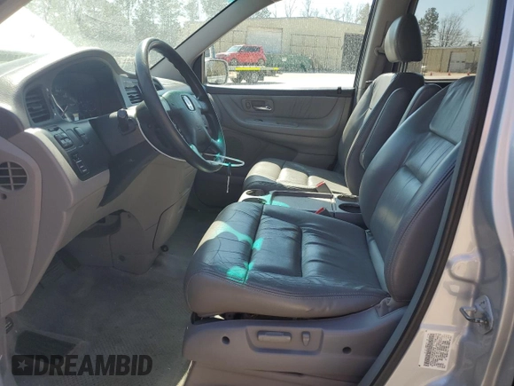 2004 Honda Odyssey EX-L with VIN 5FNRL18974B074613, listed as a Copart auction lot 48924865 with 212,633 mi miles and Salvage Title. Bid and sale history available at DreamBid. Image 7.