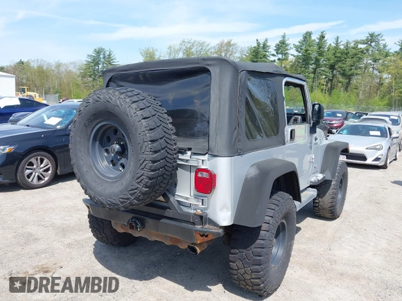 2003 Jeep Wrangler Sport z VIN 1J4FA49S73P302278, wystawiony jako IAAI lot #42219582 z przebiegiem 129 089 mil mil oraz . Historia ofert i sprzedaży dostępna na DreamBid. Obrazek 4.
