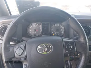 2019 Toyota Tacoma SR with VIN 3TMCZ5AN7KM251625, listed as a IAAI auction lot 42527478 with 45,689 mi miles and . Bid and sale history available at DreamBid. Image 7.