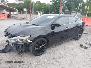 2018 Nissan Maxima Platinum z VIN 1N4AA6AP9JC392479, wystawiony jako IAAI lot #42209148 z przebiegiem 103 710 mil mil oraz . Historia ofert i sprzedaży dostępna na DreamBid. Obrazek 2.