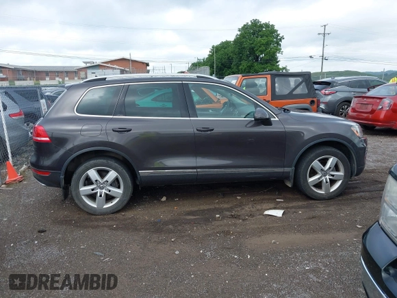 2012 Volkswagen Touareg Sport with VIN WVGFK9BP0CD002939, listed as a IAAI auction lot 42531654 with 222,435 mi miles and . Bid and sale history available at DreamBid. Image 13.