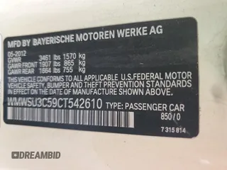 2012 MINI Hardtop with VIN WMWSU3C59CT542610, listed as a Copart auction lot 56720805 with 106,187 mi miles and Salvage Title. Bid and sale history available at DreamBid. Image 12.