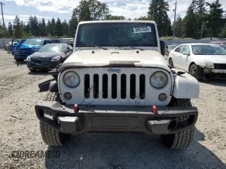 2014 Jeep Wrangler Unlimited Sahara z VIN 1C4BJWEG8EL188271, wystawiony jako Copart lot #59972535 z przebiegiem 130 314 mil mil oraz Szkoda całkowita • Salvage title. Historia ofert i sprzedaży dostępna na DreamBid. Obrazek 5.