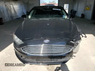 2018 Ford Fusion SE z VIN 3FA6P0HDXJR130677, wystawiony jako Copart lot #51737345 z przebiegiem 129 918 mil mil oraz Szkoda całkowita • Salvage title. Historia ofert i sprzedaży dostępna na DreamBid. Obrazek 5.