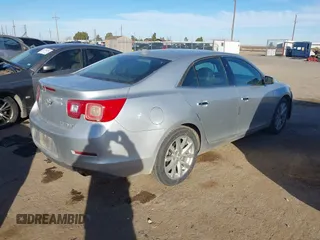 2013 Chevrolet Malibu LTZ with VIN 1G11H5SA7DU138464, listed as a IAAI auction lot 41517379 with 116,430 mi miles and . Bid and sale history available at DreamBid. Image 4.