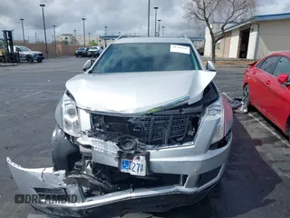 2016 Cadillac SRX Luxury Collection z VIN 3GYFNBE38GS520891, wystawiony jako IAAI lot #41781445 z przebiegiem 52 202 mil mil oraz . Historia ofert i sprzedaży dostępna na DreamBid. Obrazek 13.