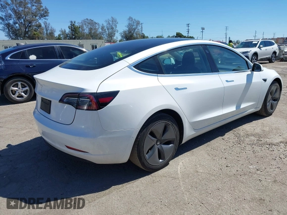 2019 Tesla Model 3 Mid Range with VIN 5YJ3E1EA1KF422983, listed as a IAAI auction lot 41861334 with 53,017 mi miles. Bid and sale history available at carsss.com. Image 4.