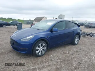 2023 Tesla Model Y Long Range z VIN 7SAYGDEE0PF840787, wystawiony jako IAAI lot #42172489 z przebiegiem 16 314 mil mil oraz . Historia ofert i sprzedaży dostępna na DreamBid. Obrazek 2.