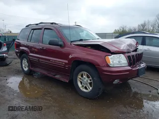 1999 Jeep Grand Cherokee Limited with VIN 1J4GW68N5XC642670, listed as a IAAI auction lot 41990199 with 154,492 mi miles. Bid and sale history available at carsss.com. Image 1.