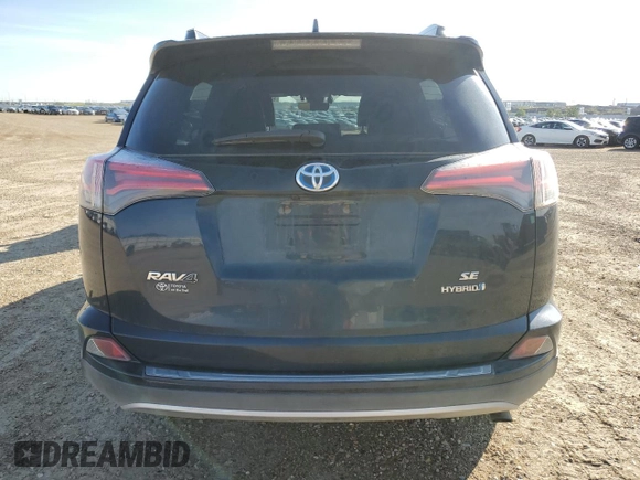 2018 Toyota RAV4 Hybrid SE with VIN JTMJJREV2JD230126, listed as a Copart auction lot 62574005 with 196,846 mi miles and Salvage title. Bid and sale history available at DreamBid. Image 6.