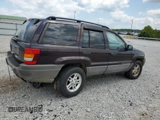 2004 Jeep Grand Cherokee Laredo with VIN 1J4GW48S64C121057, listed as a Copart auction lot 67765474 with 166,359 mi miles and Salvage title. Bid and sale history available at DreamBid. Image 3.