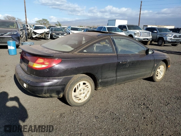 1999 Saturn SC z VIN 1G8ZR1274XZ262181, wystawiony jako Copart lot #75931774 z przebiegiem Nie podano mil oraz Szkoda całkowita • Salvage title. Historia ofert i sprzedaży dostępna na DreamBid. Obrazek 3.