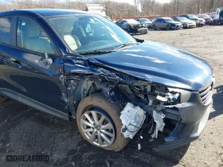 2016 Mazda CX-5 Touring with VIN JM3KE4CY6G0717393, listed as a IAAI auction lot 41596084 with 150,774 mi miles. Bid and sale history available at carsss.com. Image 17.