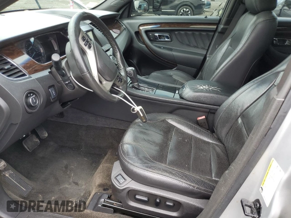 2013 Ford Taurus Limited z VIN 1FAHP2F89DG174546, wystawiony jako Copart lot #61003745 z przebiegiem 140 919 mil mil oraz Czysty tytuł • Clean title. Historia ofert i sprzedaży dostępna na DreamBid. Obrazek 7.