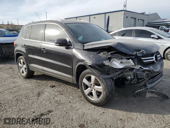 2010 Volkswagen Tiguan Wolfsburg Edition with VIN WVGAV7AX5AW002900, listed as a Copart auction lot 86214514 with 153,645 mi miles and Salvage title. Bid and sale history available at DreamBid. Image 4.