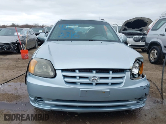 2003 Hyundai Accent GL with VIN KMHCG35C23U264360, listed as a IAAI auction lot 42033316 with 100,991 mi miles. Bid and sale history available at carsss.com. Image 12.