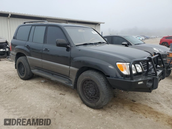 2001 Lexus LX 470 z VIN JTJHT00W513509447, wystawiony jako Copart lot #43988595 z przebiegiem 251 861 mil mil oraz Tytuł czysty. Historia ofert i sprzedaży dostępna na DreamBid. Obrazek 4.